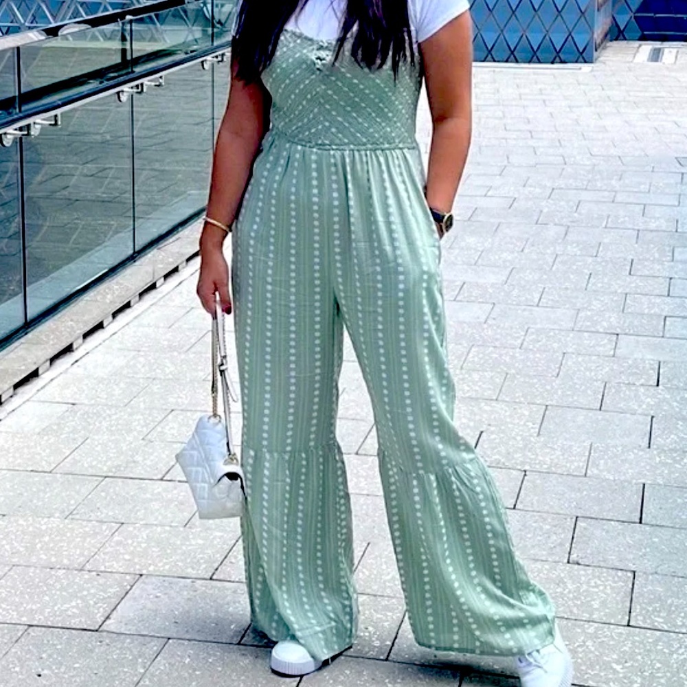 NWOT’s Sincerely Jules smocked  floral flare leg jumpsuit